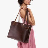 Coldbrew Large Classic | Model wearing leather tote bag with riveted straps and exterior key loop