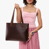 Coldbrew Large Classic | Model wearing leather tote bag with riveted straps and exterior key loop