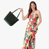 Evergreen Medium Zipper | Model wearing leather tote bag with riveted straps and exterior key loop