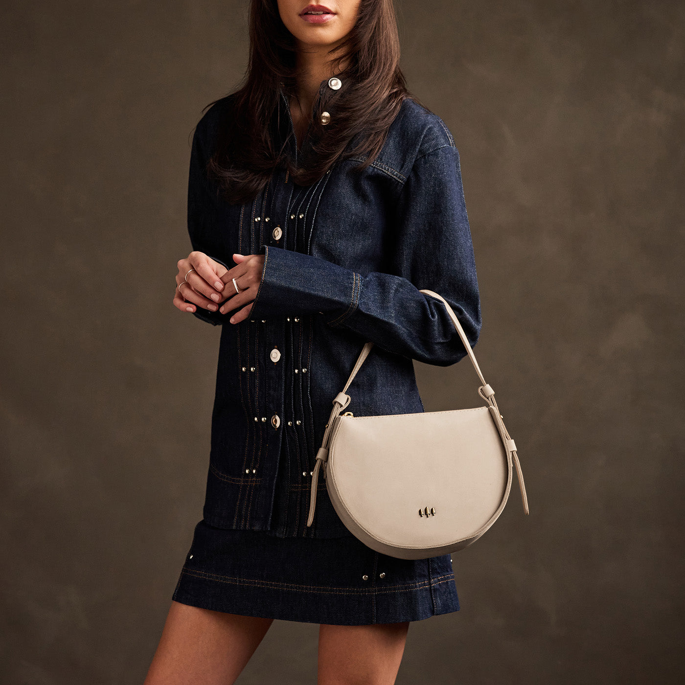 Dragon Bone | Model wearing a rounded structured shoulder bag