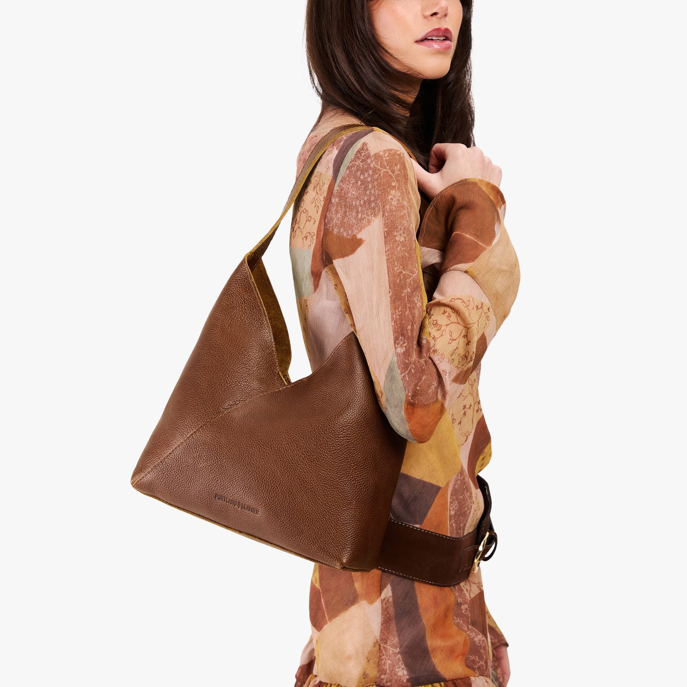 Asheville*Large | Model wearing mid-size shoulder bag with magnetic snap closure