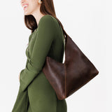 Coldbrew Large | Model wearing mid-size shoulder bag with magnetic snap closure
