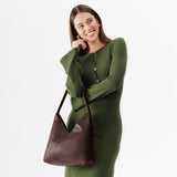Coldbrew Large | Model wearing mid-size shoulder bag with magnetic snap closure