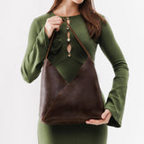Coldbrew Large | Model wearing mid-size shoulder bag with magnetic snap closure