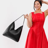Pebbled--black Oversized | Model wearing large shoulder bag with magnetic snap closure