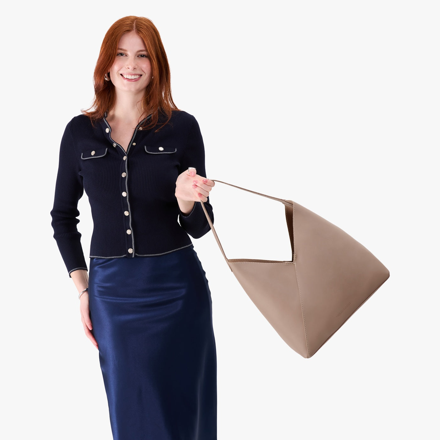 Stone*Oversized | Model wearing large shoulder bag with adjustable strap and magnetic snap closure