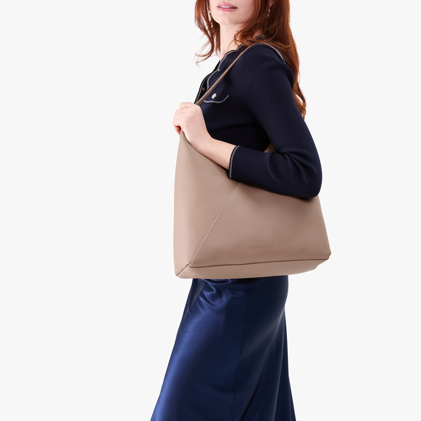 Stone*Oversized | Model wearing large shoulder bag with adjustable strap and magnetic snap closure
