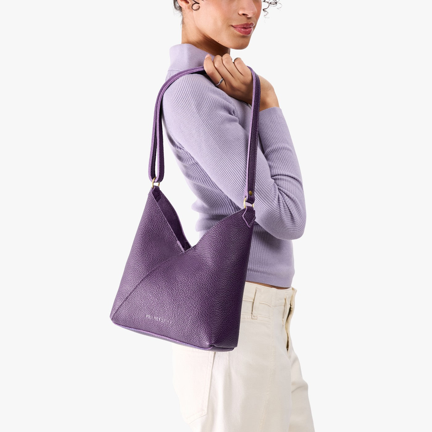 Empire*Small | Model wearing petite shoulder bag with adjustable strap and magnetic snap closure