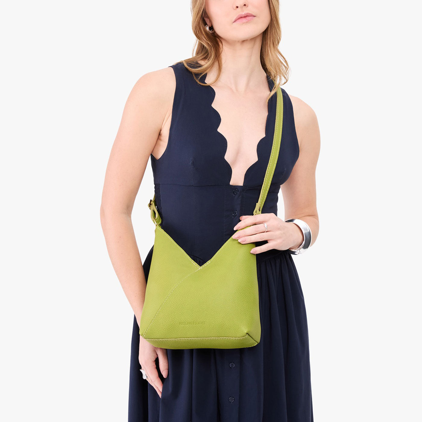 Wasabi*Small | Model wearing petite shoulder bag with adjustable strap and magnetic snap closure
