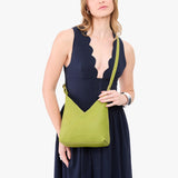 Wasabi Small | Model wearing petite shoulder bag with adjustable strap and magnetic snap closure