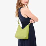 Wasabi Small | Model wearing petite shoulder bag with adjustable strap and magnetic snap closure