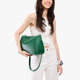 Bacalar Medium | Model wearing a leather Crossbody with a flap and magnetic closure