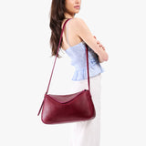 Orchid Medium | Model wearing a leather Crossbody with a flap and magnetic closure
