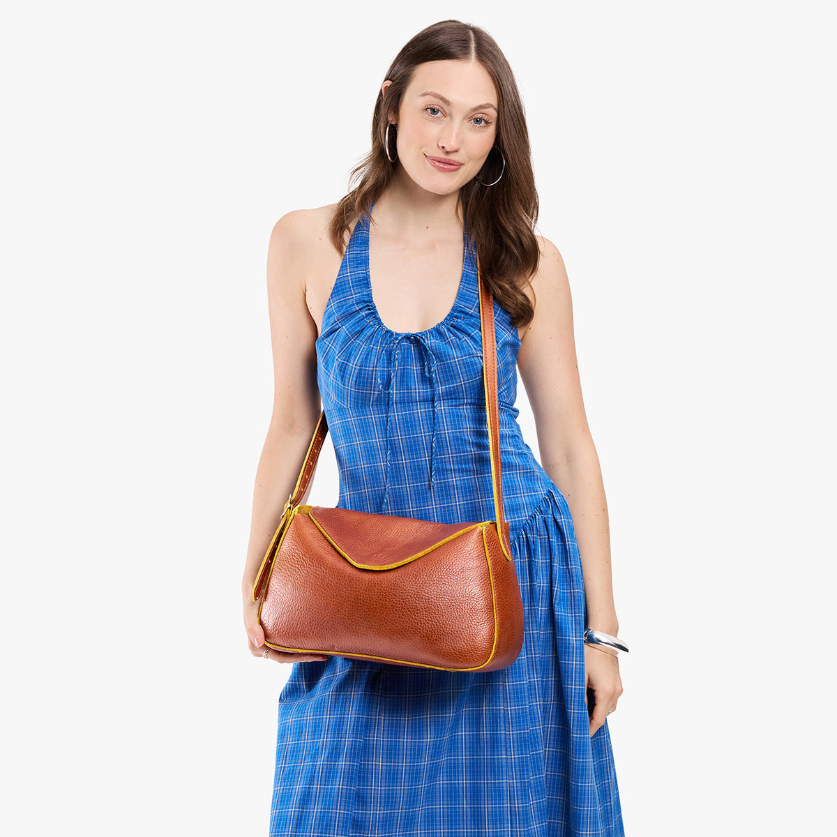 Sienna*Medium | Model wearing a leather Crossbody with a flap and magnetic closure