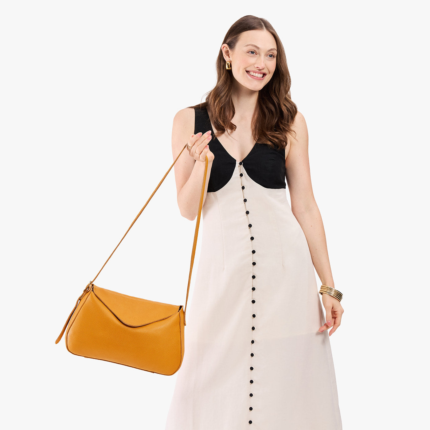 Sunshine*Medium | Model wearing a leather Crossbody with a flap and magnetic closure