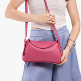 Wild Rose Small | Model wearing a leather Crossbody with a flap and magnetic closure