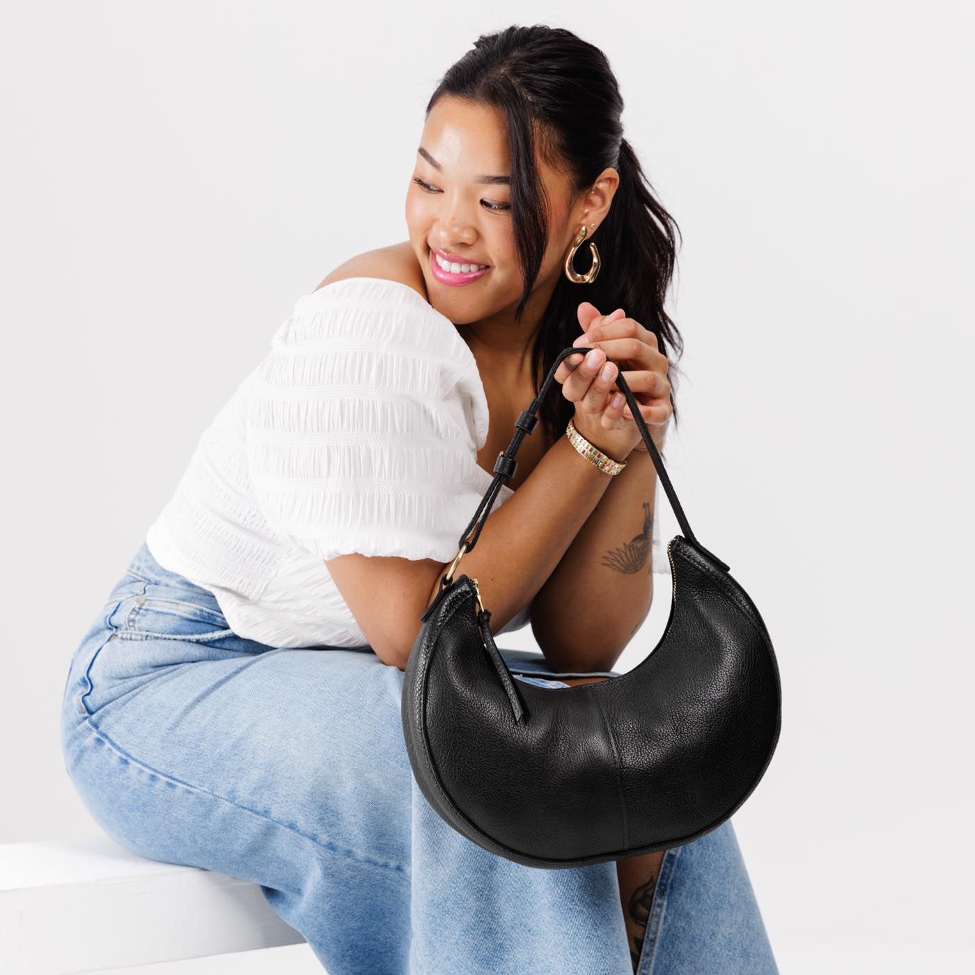 Pebbled--black*Classic | Crescent shaped shoulder bag with zipper closure and adjustable strap