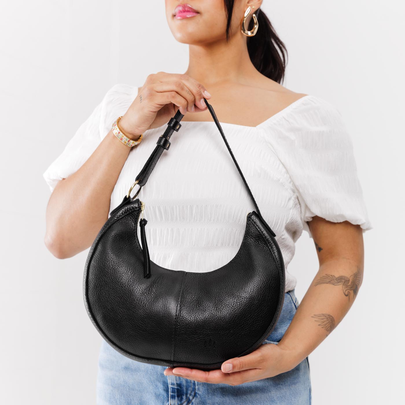 Pebbled--black*Classic | Crescent shaped shoulder bag with zipper closure and adjustable strap