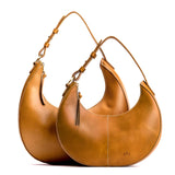 Mango | Crescent shaped shoulder bag with zipper closure and adjustable strap