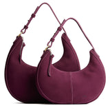 Superbloom | Crescent shaped shoulder bag with zipper closure and adjustable strap