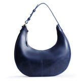 Cowboy Blue Large | Crescent shaped shoulder bag with zipper closure and adjustable strap