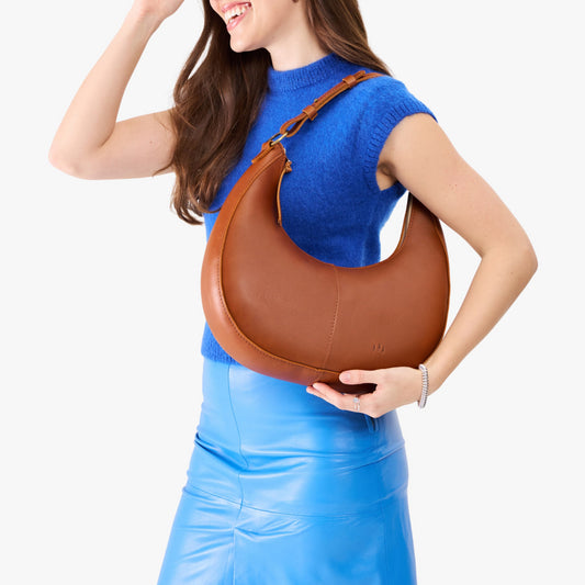 Honey*Large | Crescent shaped shoulder bag with zipper closure and adjustable strap