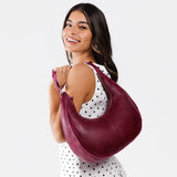 Orchid Large | Crescent shaped shoulder bag with zipper closure and adjustable strap