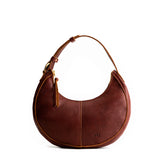 Nutmeg Small | Crescent shaped shoulder bag with zipper closure and adjustable strap
