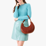 Nutmeg Small | Crescent shaped shoulder bag with zipper closure and adjustable strap