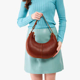 Nutmeg Small | Crescent shaped shoulder bag with zipper closure and adjustable strap