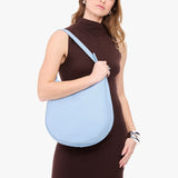 Skyway Large | Model carrying round leather purse with adjustable shoulder strap