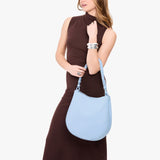 Skyway Large | Model carrying round leather purse with adjustable shoulder strap