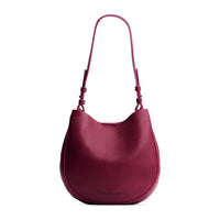 Orchid*Medium | Rounded shoulder bag with adjustable strap on a white background