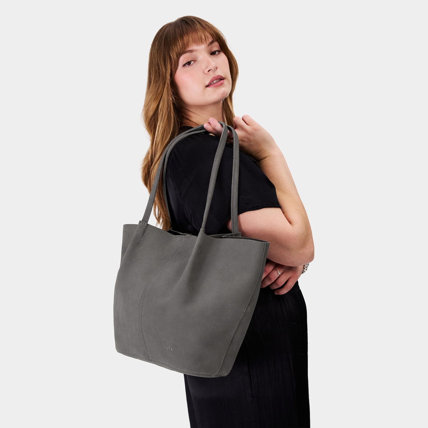 Smoke Grey*Oversized | Model holding extra wide bucket shaped tote bag with matching leather handles