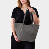 Smoke Grey Oversized | Model holding a  leather tote bag 