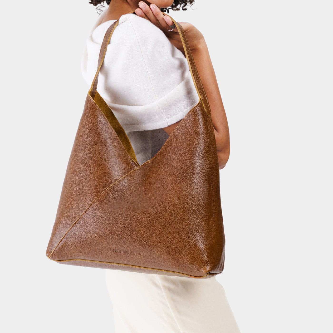 Asheville*Oversized | Model wearing large shoulder bag with magnetic snap 