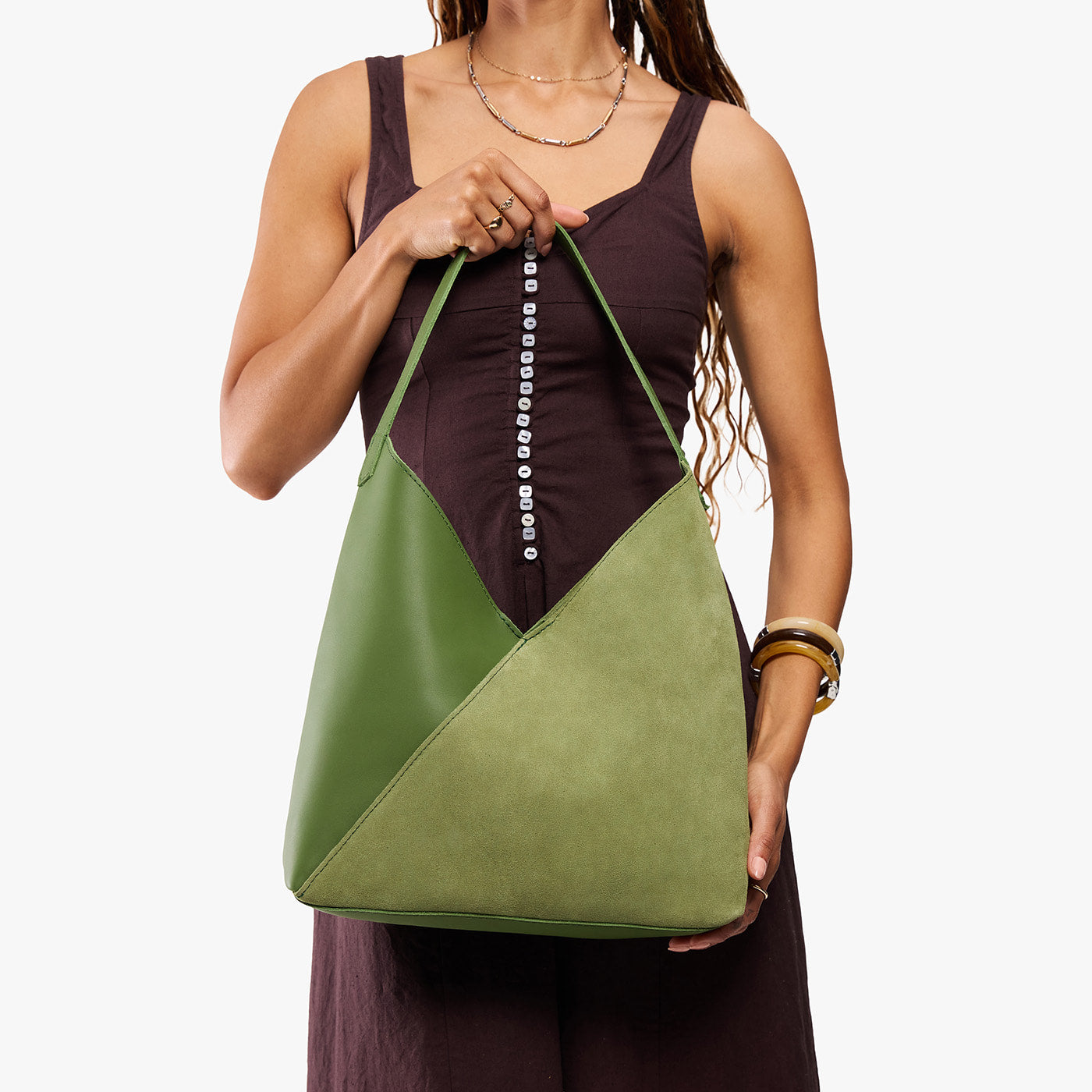 Dryland Green*Oversized | Model holding large shoulder bag with adjustable strap and magnetic snap closure