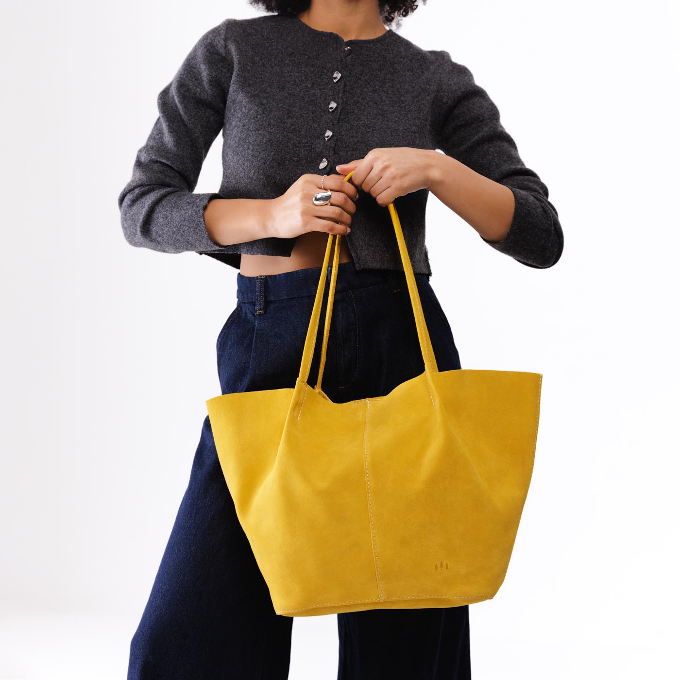 Hello Yellow*Oversized | Model holding extra wide bucket shaped tote bag with matching leather handles
