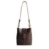 Coldbrew | Leather bucket shoulder bag with adjustable strap and magnetic closure on a white background