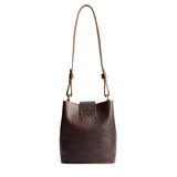 Coldbrew | Leather bucket shoulder bag with adjustable strap and magnetic closure on a white background