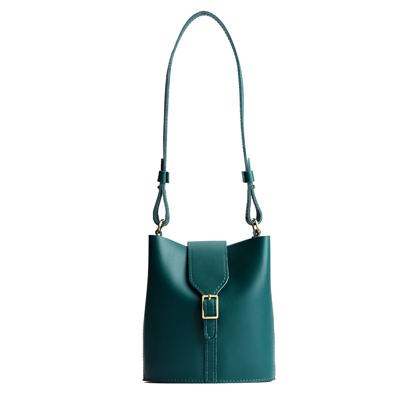 Harbor | Leather bucket shoulder bag with adjustable strap and magnetic closure on a white background