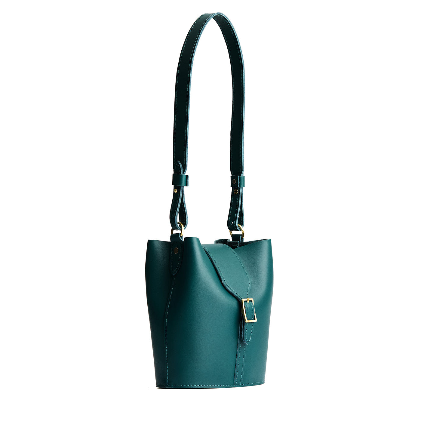 Harbor | Leather bucket shoulder bag with adjustable strap and magnetic closure on a white background