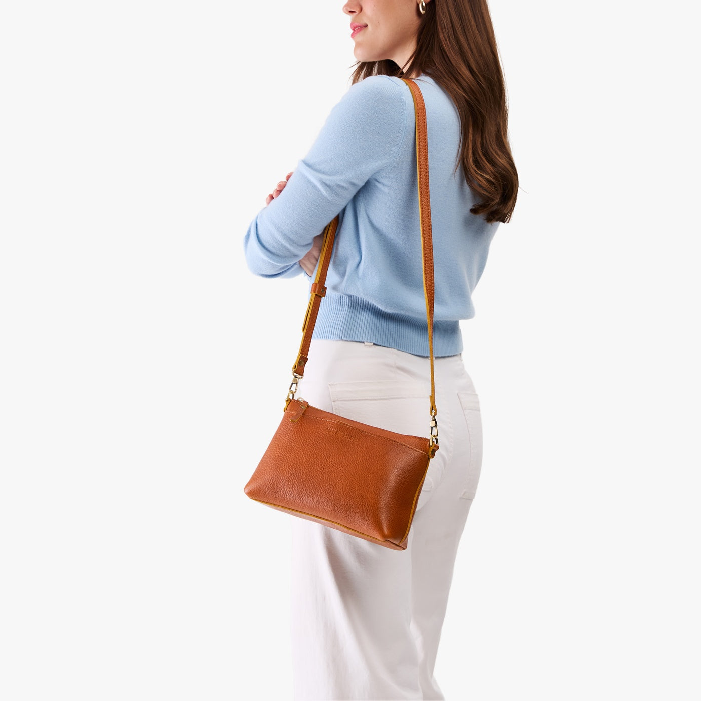 Sienna*Classic | Model wearing a zip top crossbody bag with detachable strap