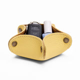 Butter Bliss | Star-shaped foldable leather tray with snap-button corners holding nail polish and car keys