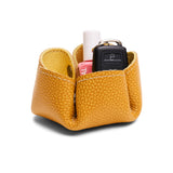 Butter Bliss | Flower-shaped foldable leather tray with snap-button corners holding nail polish and car keys