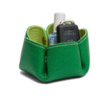 Shadow Lime | Flower-shaped foldable leather tray with snap-button corners holding nail polish and car keys