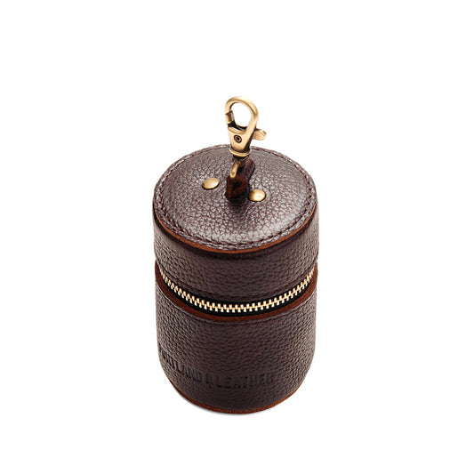 Coldbrew | Cylindrical shaped pouch with a gold zipper and swivel lobster claw clasp