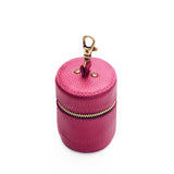 Cosmo | Cylindrical shaped pouch with a gold zipper and swivel lobster claw clasp