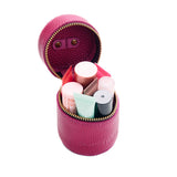 Cosmo | Cylindrical shaped pouch with a gold zipper and swivel lobster claw clasp