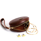 Cognac Small | Oval shaped pouch with zipper and wristlet strap